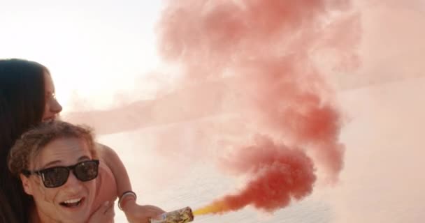 Happy Couple Man Carrying Woman On His Back on Beach Lake Shore Passing Through Clouds Of Smoke Relationship Goals Happy Family Concept Slow Motion Shot On Red Epic W 8k — 비디오