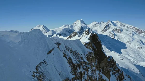 Epic Aerial Over Snowy Mountain Range Landscape At Evening Morning Summit Cold Winter Ski Vacation Existential Thoughts Nature