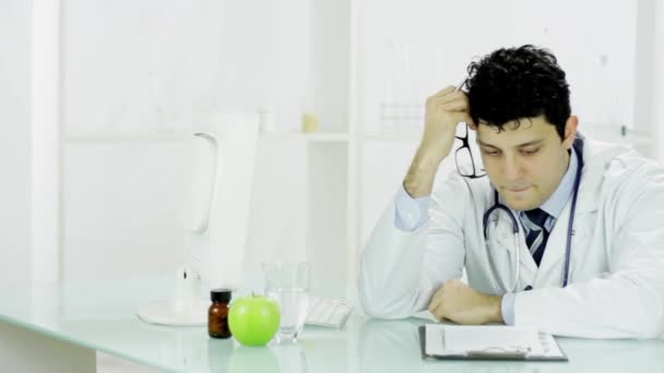 Sad Depressed Guilty Doctor Signing Bad News Results — Stock Video