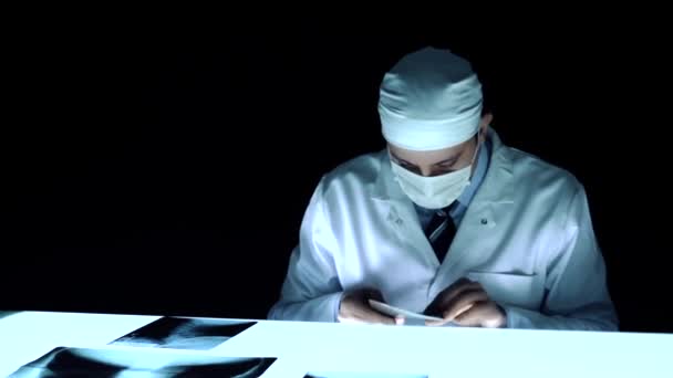 Physician Dark Room Laboratory Looking Examining x rays — Stock Video