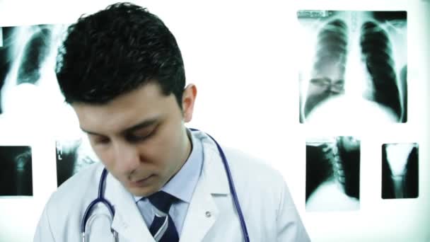 Young Doctor Examining Camera with Stethoscope Smiling OK — Stock Video