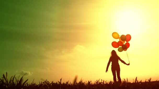 Woman with Balloons Walking on Meadow — Stock videók