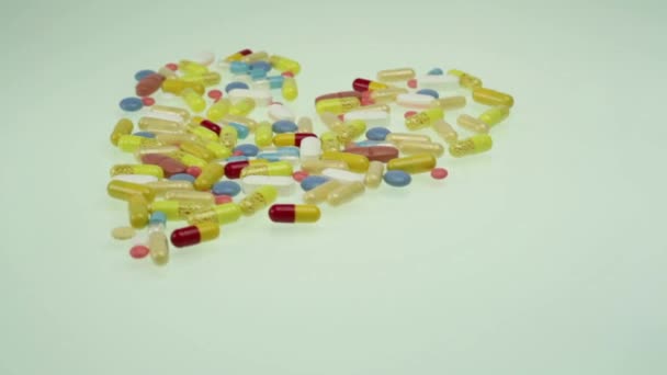 Heart Shape of colourful pills — Stock Video