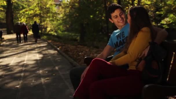 Young Happy Couple on Park bench — Stock Video