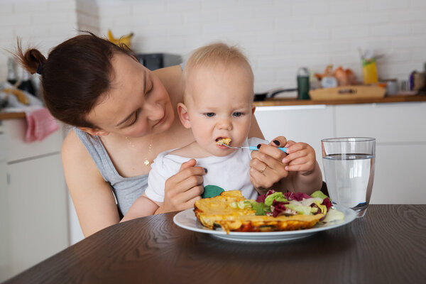 Mother and child eating together