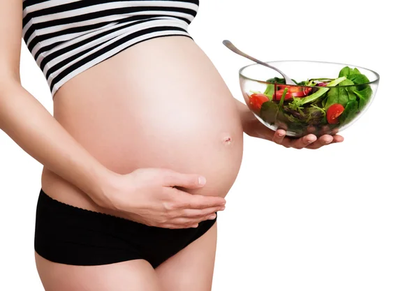 Pregnant woman with a bowl of vegetables — Stock Photo, Image