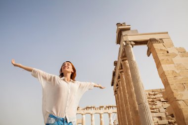 The tourist near the Acropolis of Athens, Greece clipart