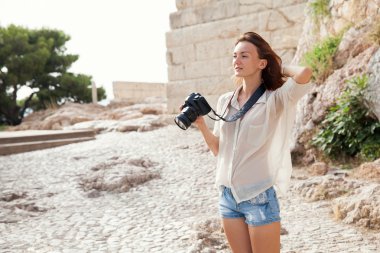 The tourist near the Acropolis of Athens, Greece clipart