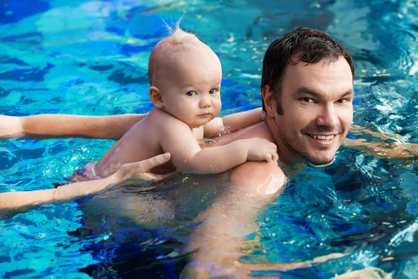Smiling charming baby in swimming pool — Stock Photo, Image
