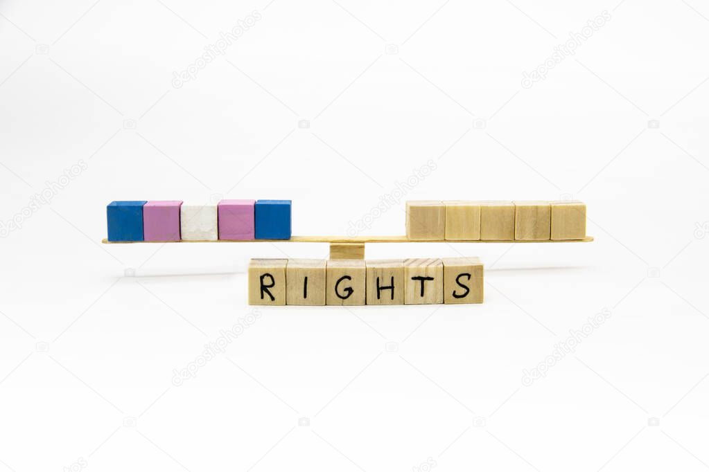 The colors of transgender flag on the wood cubes. Conceptual photo for rights lesbian, gay, bisexual, and transgender