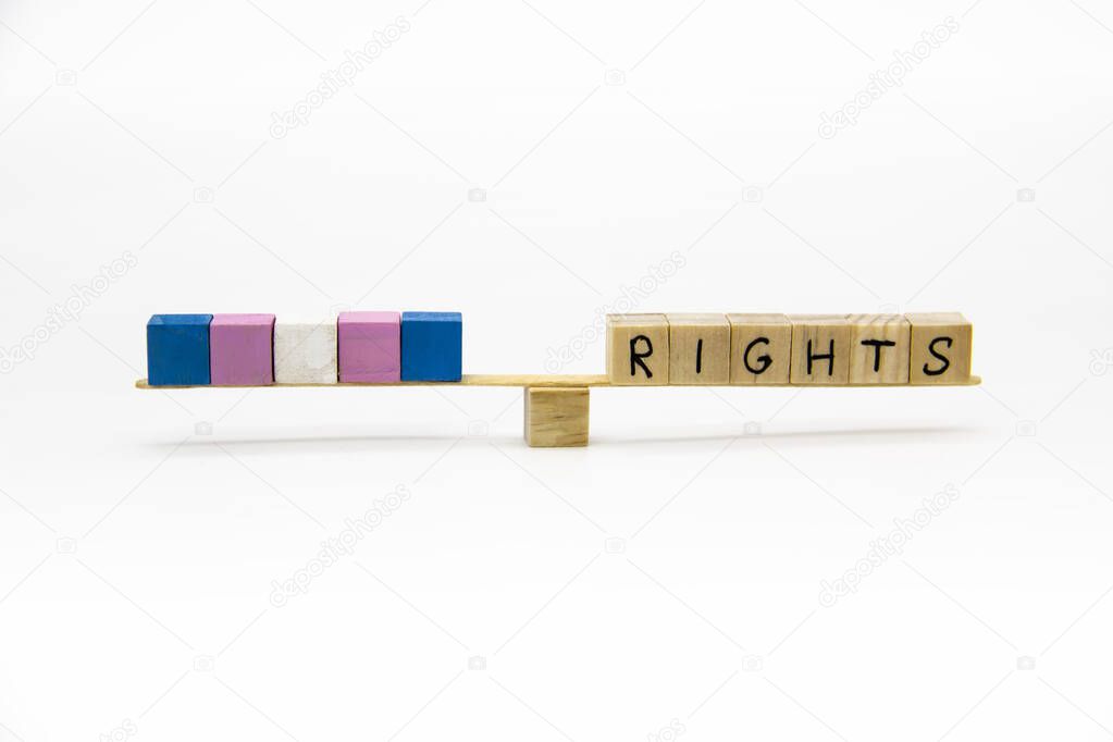 The colors of transgender flag on the wood cubes. Conceptual photo for rights lesbian, gay, bisexual, and transgender