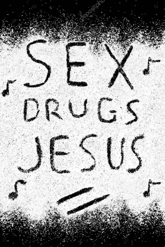 Beautiful background of white sand with words SEX, DRUGS, JESUS.
