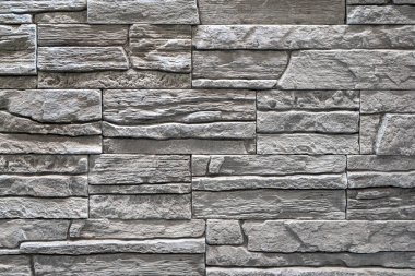 Duvardaki kaldırım taşları arkaplanı kapatın