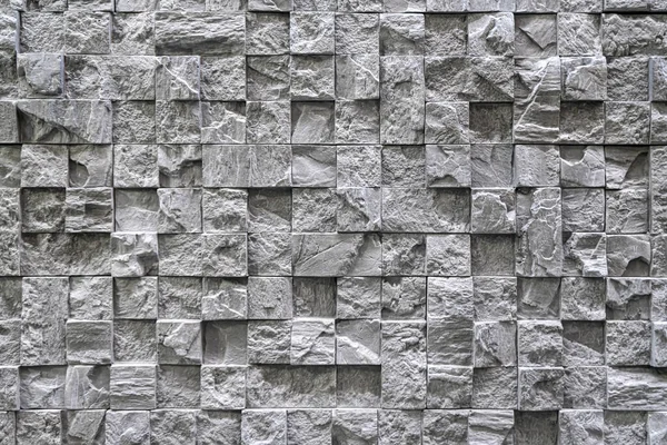 Duvardaki kaldırım taşları arkaplanı kapatın