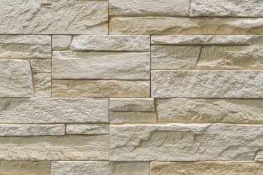 Duvardaki kaldırım taşları arkaplanı kapatın