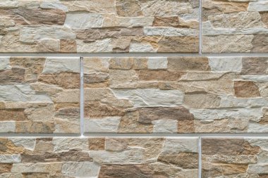 Duvardaki kaldırım taşları arkaplanı kapatın