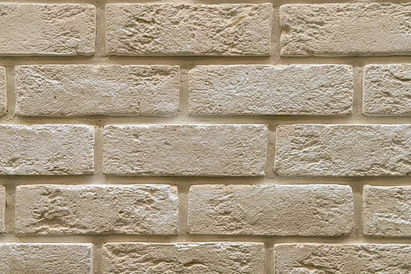 Duvardaki kaldırım taşları arkaplanı kapatın