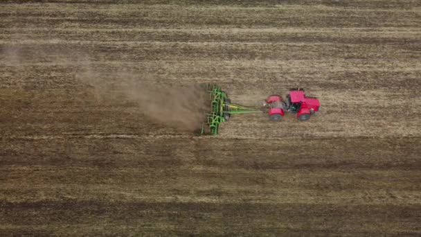 Cultivation of soil by tractor view from a height — Stock Video