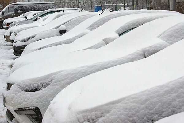 cars in the Parking lot are covered with fres