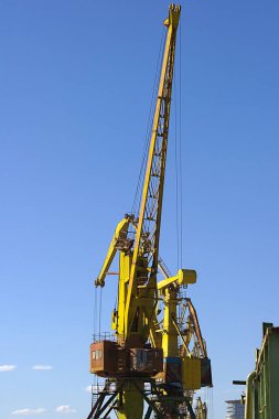 crane in the port at the loading of a barge