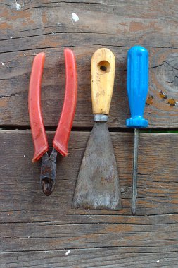 various tools on the boardwalk of the barn