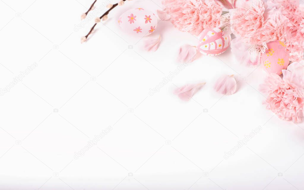 Pastel pink Easter eggs with pink flowers on white background