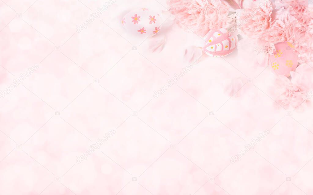  Easter eggs with pink flowers on on pastel pink background