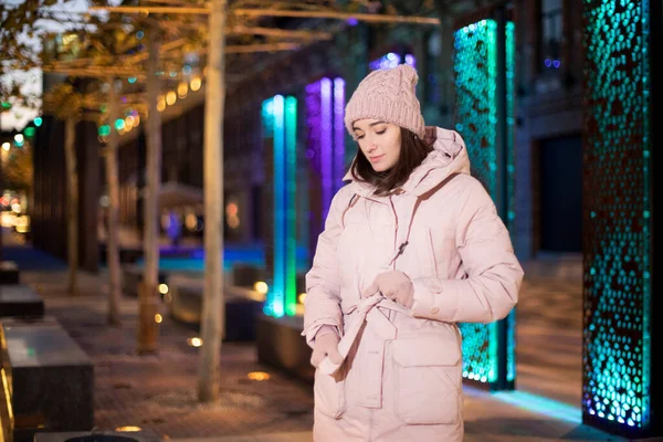 young girl in pink winter clothes