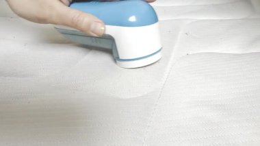 Bir el pamuk çıkarıcı, çamaşır temizleme aleti.