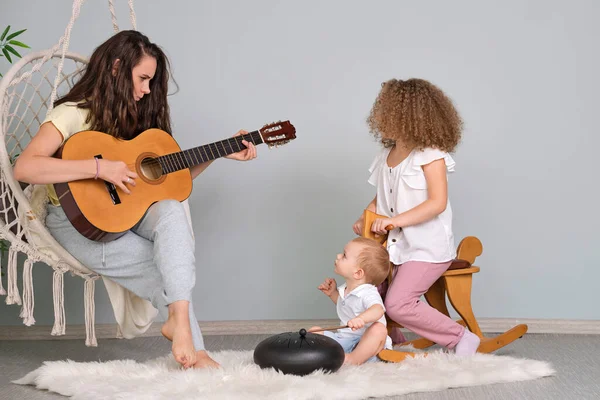 Single Mum Playing Guitar