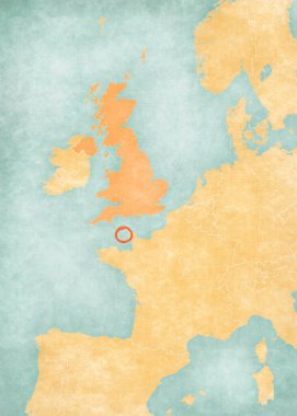 Guernsey, Batı Avrupa haritasında suluboya resimli eski bir kağıt gibi yumuşak grunge ve vintage tarzında yer alıyor..