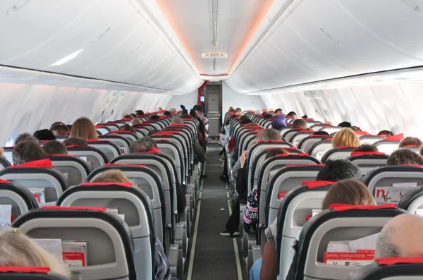 Airplane aircraft cabin seats flight aisle — Stock Photo, Image