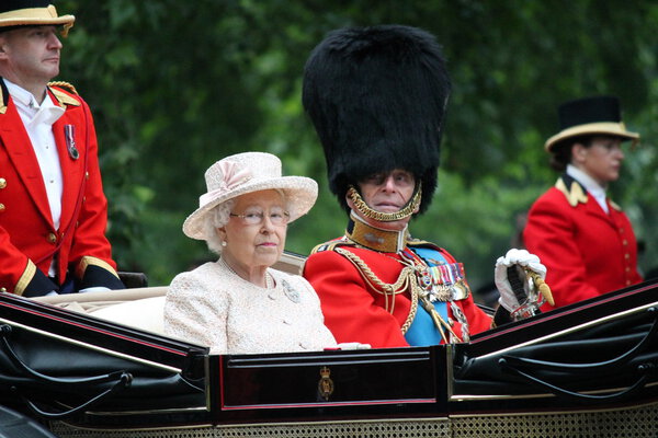 QUEEN ELIZABETH, LONDON - JUNE 13: Queen Elizabeth II and Prince Philip seat on the Royal Coach at Queen 's Birthday Parade, also known as Trooping the Colour, on June 13, 2015 in London, England
.