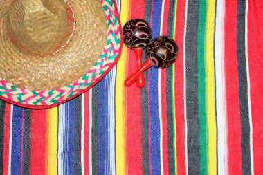 Mexico poncho sombrero maracas background fiesta cinco de mayo fiesta theme  stock, photo, photograph, image, picture, clipart