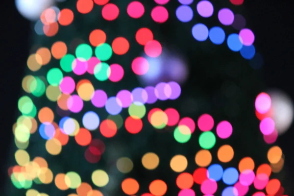 Abstracte Bokeh Kerstmis achtergrond cirkels van lichte regenboog — Stockfoto