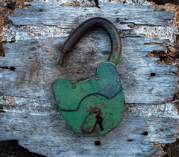 Old Rusty Padlock on Wooden Surface — Stock Photo, Image