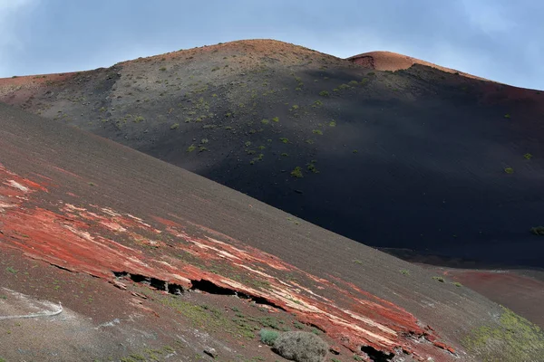 Colorful volcanic landscape at the Timanfaya National Park. Lanzarote, Canary Islands, Spain.