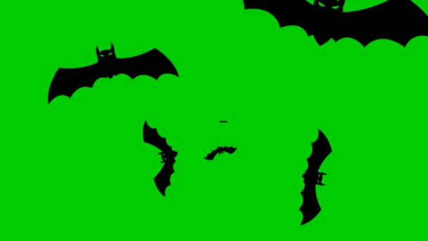 アニメーション化された黒いコウモリが画面の中央から飛び出す ループビデオだ コンセプトオグハロウィン ブラックフライデー 緑の背景に独立したベクトル図 — ストック動画