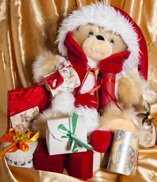Doll with hat of santa claus and gifts — Stock Photo, Image
