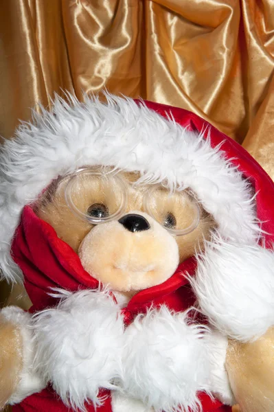 Bambola con cappello di Babbo Natale e regali — Foto Stock