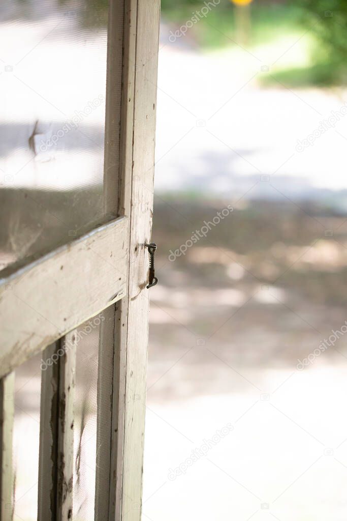Close up of an open, retro porch door
