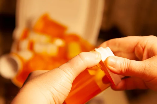 Woman Opening Medication Bottle Pile Bottles Background — Stock Photo, Image