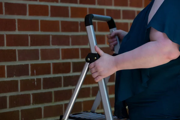 Woman Setting Step Ladder Red Brick Wall — Stock Photo, Image