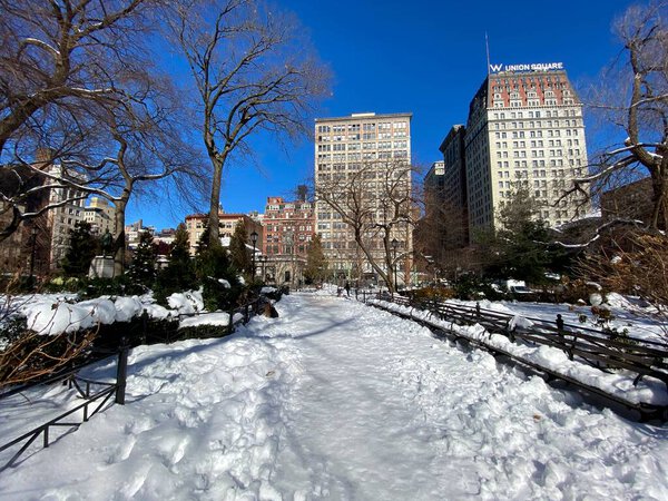 New York, NY, USA - Feb 8, 2021: Extensive snow covered pedestrian areas of Union Square Park