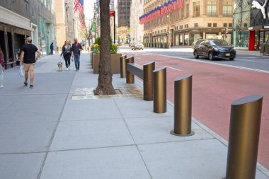 New York, NY, USA - May 26, 2021: Bollards on sidewalk to prevent accidental or intentional vehicle access