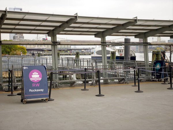 New York, NY, USA - July 25, 2021: NYC Ferry entrance near Wall Street that provides direct water transportation to the Rockaways