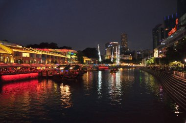 Singapore-july 28: Colorful light building at night in Clarke Quay Singapore-july 28,2012. Singapore Clarke Quay, is a historical riverside quay in Singapore, located within the Singapore River Area.
