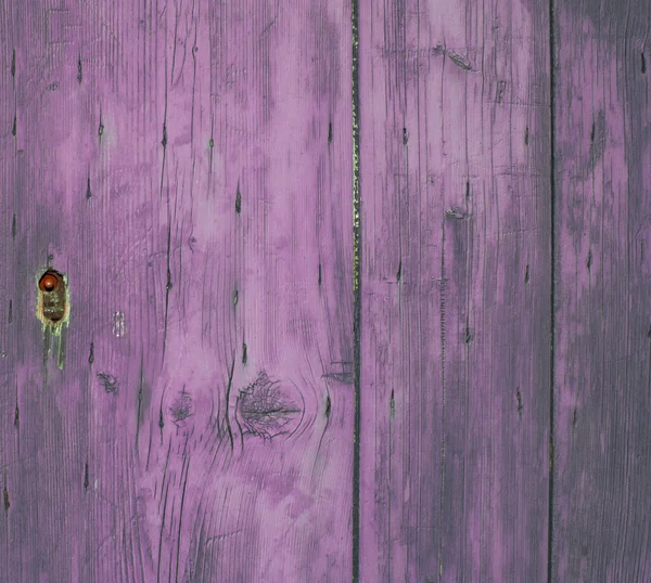 Lock on purple wooden door — Stock Photo, Image