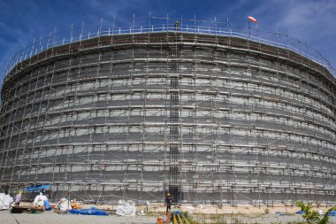 A view of scaffolding for the storage tank oil construction clipart