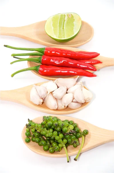 Ingredients of thai food on wooden spoon (chili, pepper, garlic — Stock Photo, Image